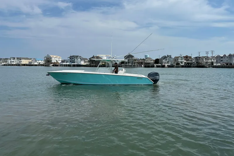 Slide: The Image of 2010 Jupiter 34 FS boat on calm water near coastal homes. - 8