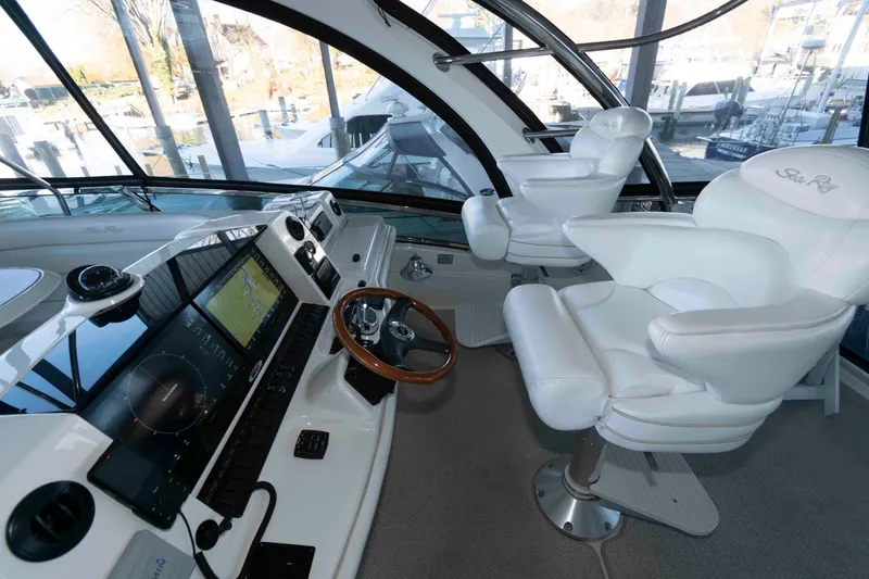 Slide: The Image of Interior helm of 2008 Sea Ray 52 Sedan Bridge with modern navigation equipment. - 10