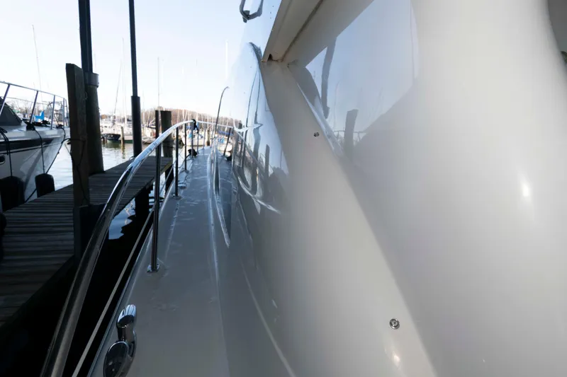 Slide: The Image of 2008 Sea Ray 52 Sedan Bridge yacht docked at marina, side view. - 18