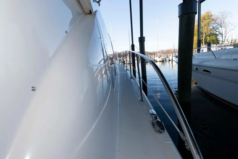 Slide: The Image of 2008 Sea Ray 52 Sedan Bridge yacht docked at marina, side view. - 19