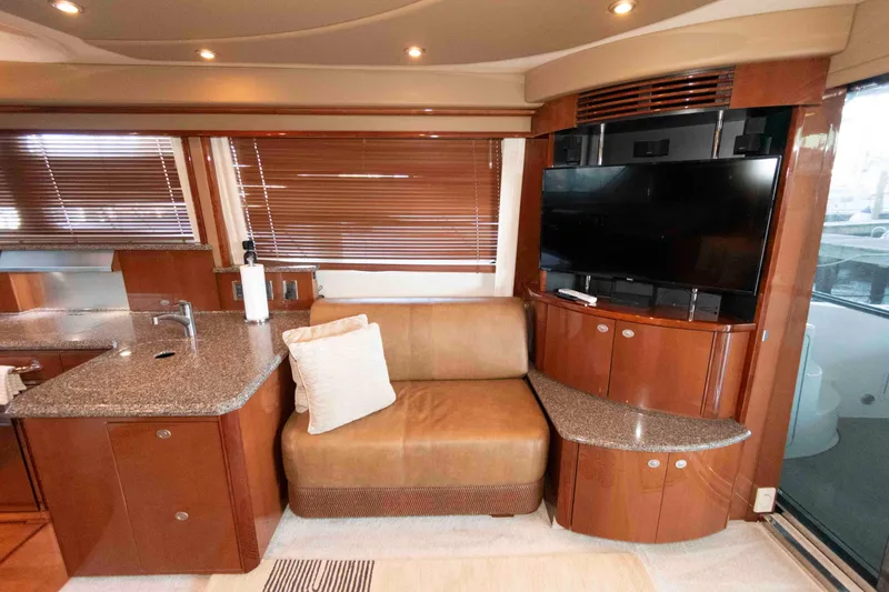 Slide: The Image of Luxurious 2008 Sea Ray 52 Sedan Bridge interior with modern seating and entertainment area. - 23