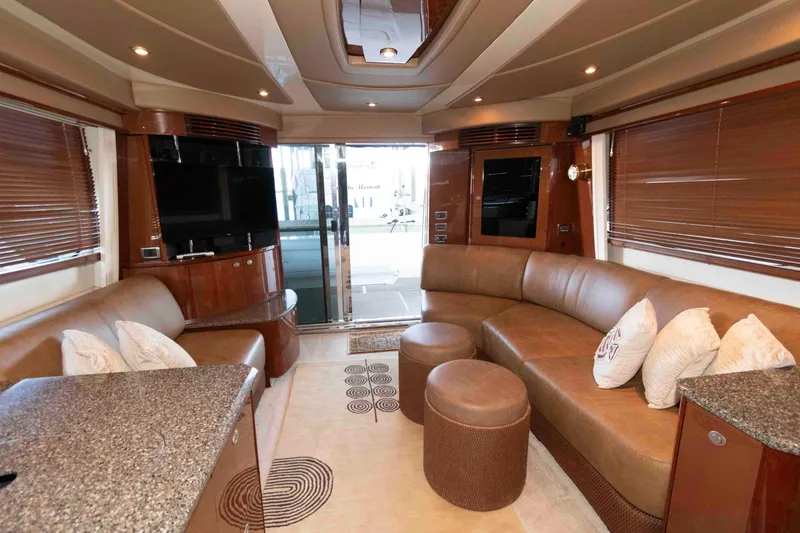 Slide: The Image of Luxurious interior of a 2008 Sea Ray 52 Sedan Bridge yacht with plush seating and modern decor. - 27