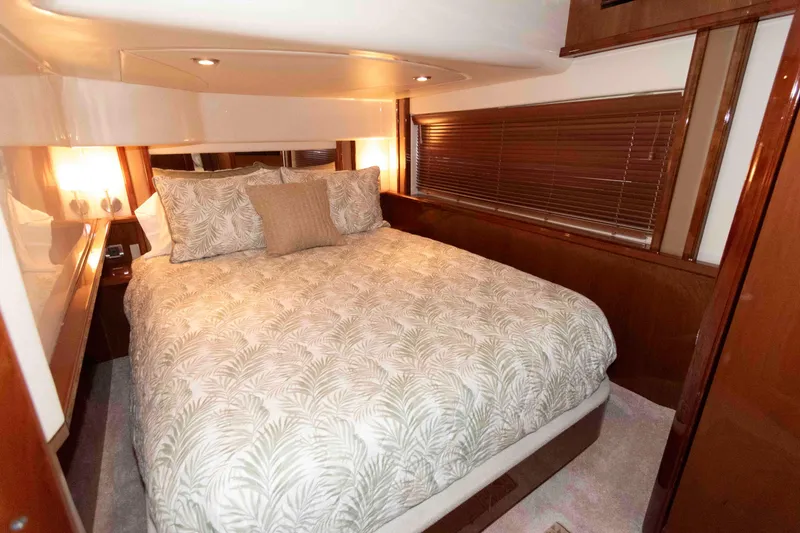 Slide: The Image of Luxurious bedroom interior of 2008 Sea Ray 52 Sedan Bridge yacht with elegant bedding. - 28