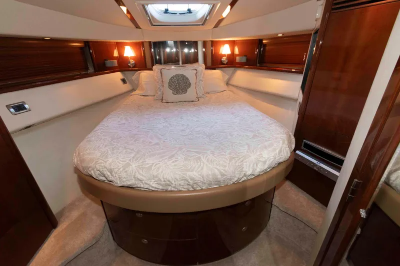 Slide: The Image of Luxurious bedroom interior of 2008 Sea Ray 52 Sedan Bridge yacht with elegant bedding. - 30