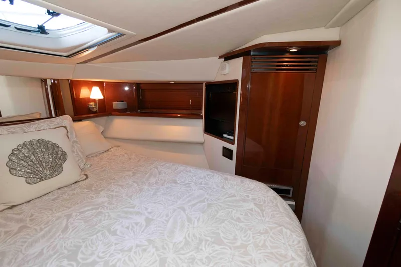 Slide: The Image of Luxurious bedroom interior of 2008 Sea Ray 52 Sedan Bridge yacht with elegant wood finishes. - 31