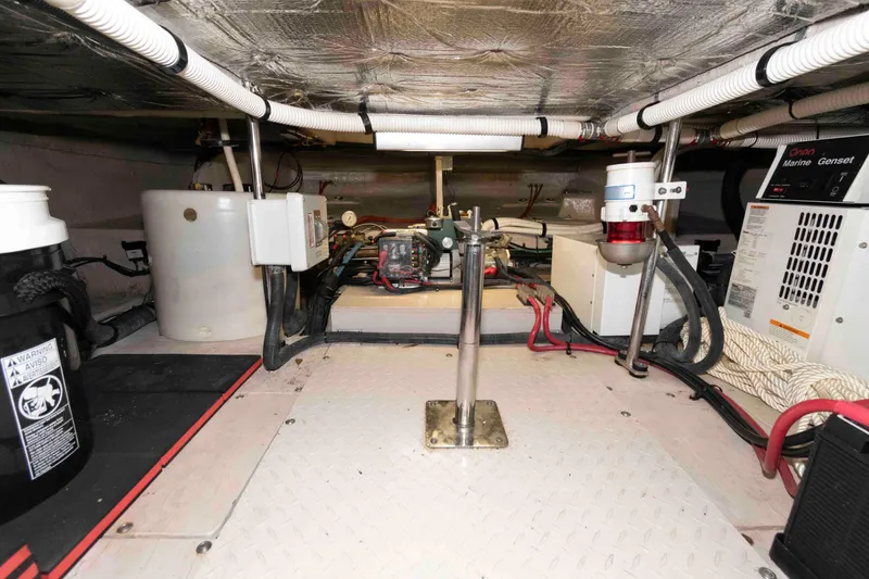 Slide: The Image of Engine room of 2008 Sea Ray 52 Sedan Bridge with equipment and wiring. - 36