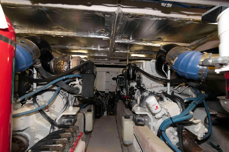Slide: The Image of Engine room of a 2008 Sea Ray 52 Sedan Bridge yacht, showcasing dual engines and mechanical components. - 37