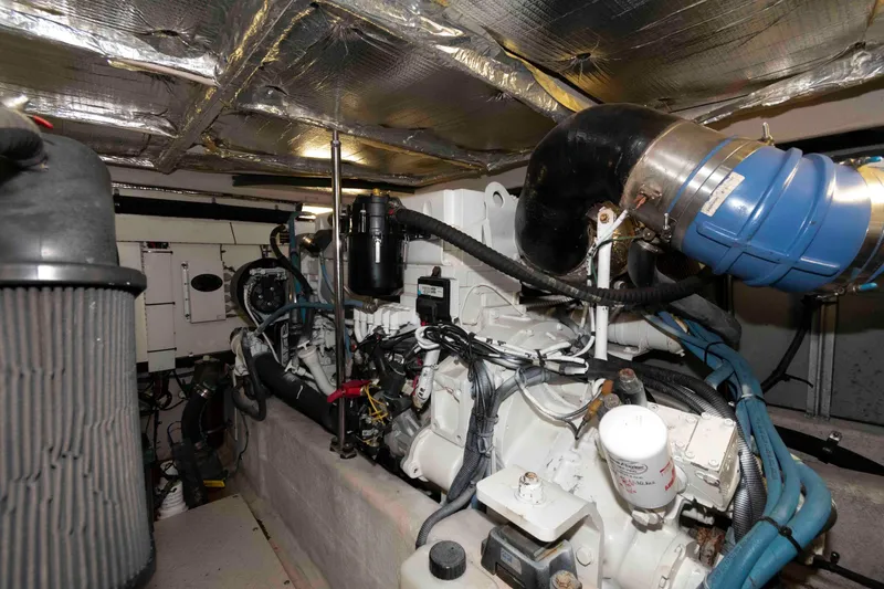 Slide: The Image of Engine room of a 2008 Sea Ray 52 Sedan Bridge yacht, showcasing mechanical components. - 38
