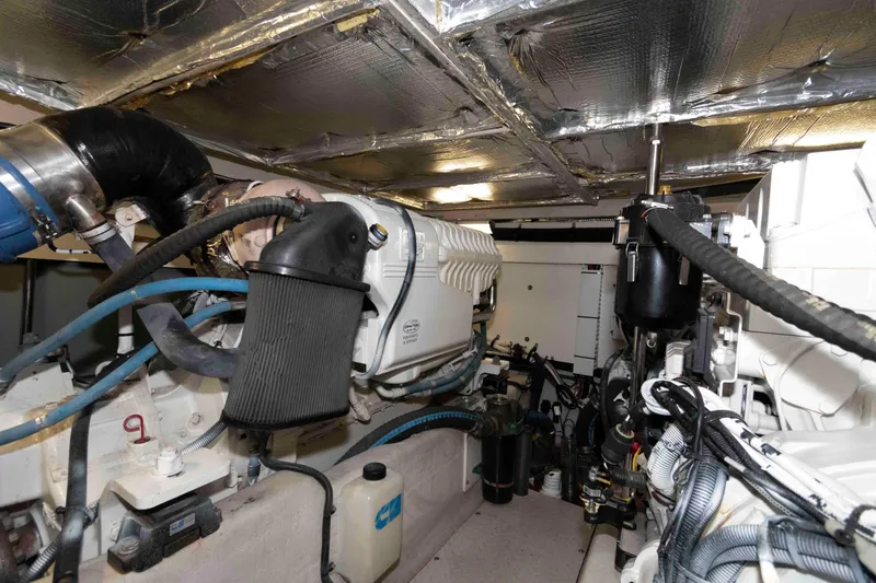 Slide: The Image of Engine room of 2008 Sea Ray 52 Sedan Bridge yacht, showcasing mechanical components. - 39