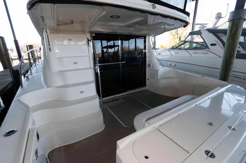 Slide: The Image of 2008 Sea Ray 52 Sedan Bridge yacht interior with sleek design and spacious seating area. - 5