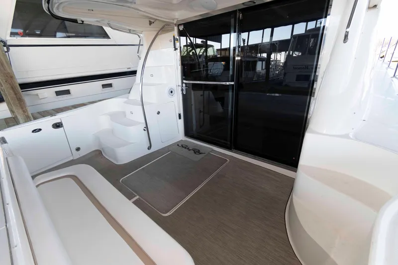 Slide: The Image of 2008 Sea Ray 52 Sedan Bridge yacht interior with seating and steps. - 8