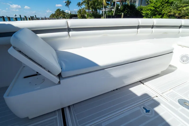 Slide: The Image of 2015 Intrepid 400 Center Console boat with white cushioned seating. - 100