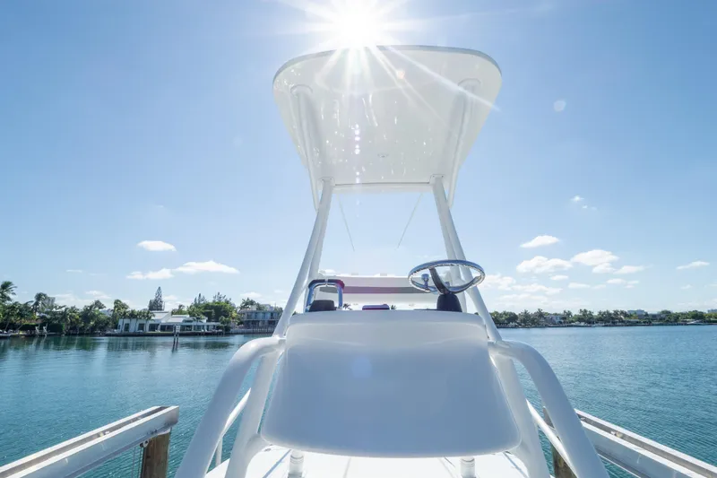 Slide: The Image of 2015 Intrepid 400 Center Console boat on calm water, sunny day, docked. - 107