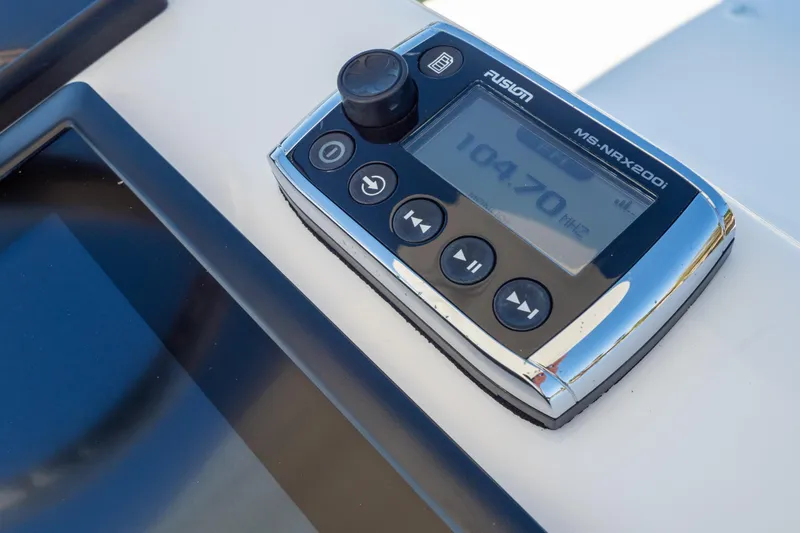 Slide: The Image of Throttle controls on a 2015 Intrepid 400 Center Console boat dashboard. - 109