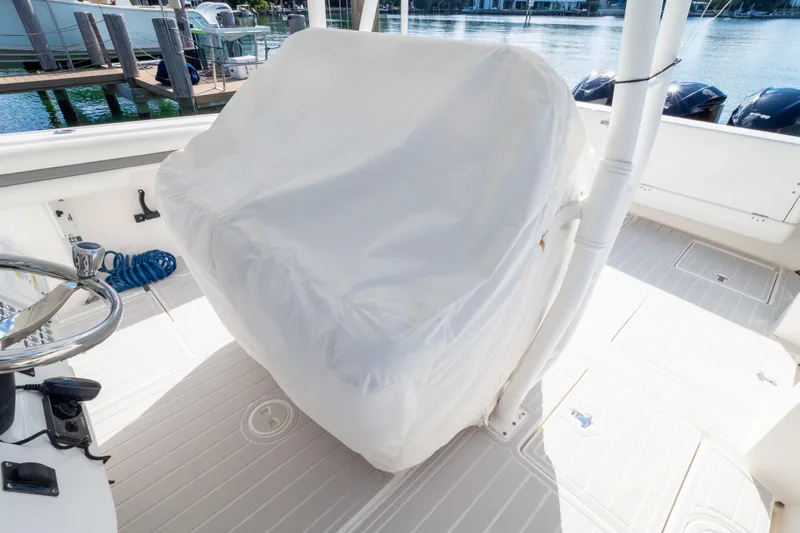 Slide: The Image of 2015 Intrepid 400 Center Console boat interior with covered seating area. - 121