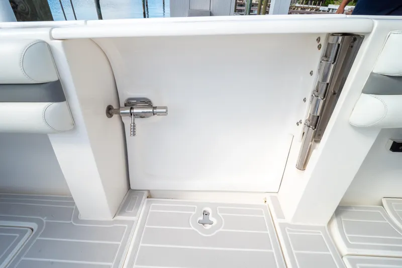 Slide: The Image of 2015 Intrepid 400 Center Console boat door with stainless steel latch and hinge. - 27