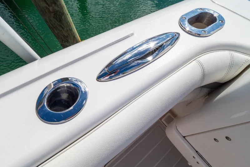 Slide: The Image of 2015 Intrepid 400 Center Console boat with chrome fittings and white upholstery. - 32