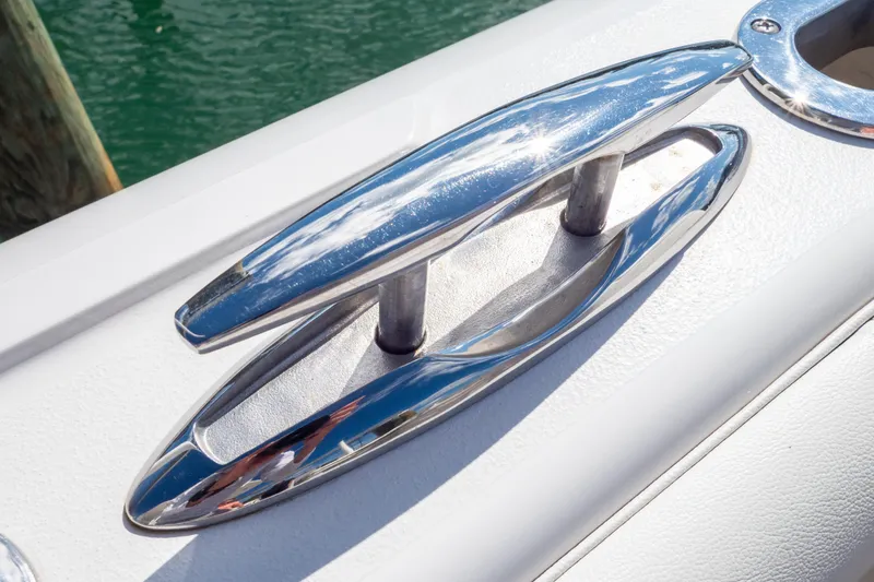 Slide: The Image of Close-up of a polished cleat on a 2015 Intrepid 400 Center Console boat. - 33