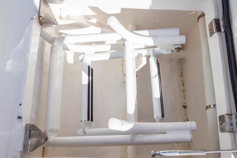 Slide: The Image of Storage compartment of a 2015 Intrepid 400 Center Console boat with gas struts. - 41