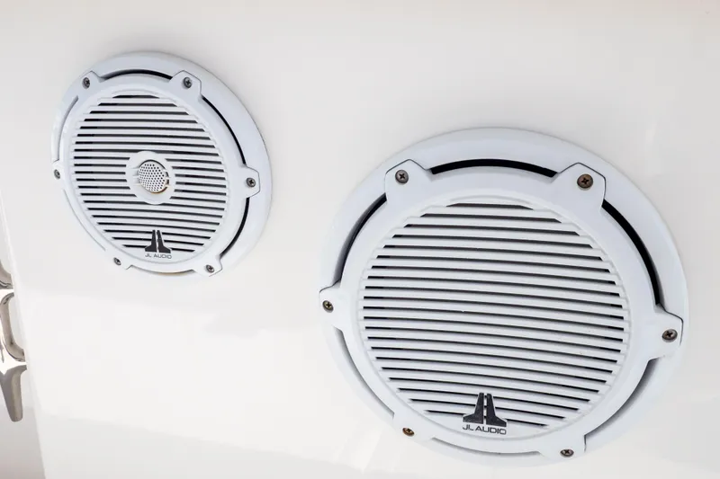 Slide: The Image of White JL Audio speakers on a 2015 Intrepid 400 Center Console boat. - 62