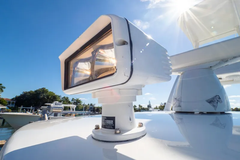 Slide: The Image of Close-up of a spotlight on a 2015 Intrepid 400 Center Console boat under sunny skies. - 67