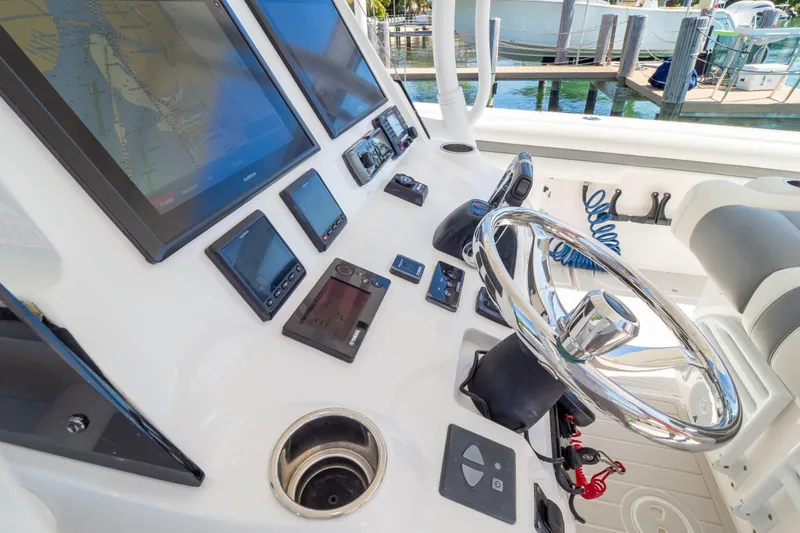 Slide: The Image of Control panel of 2015 Intrepid 400 Center Console with Yamaha throttle and steering wheel. - 78