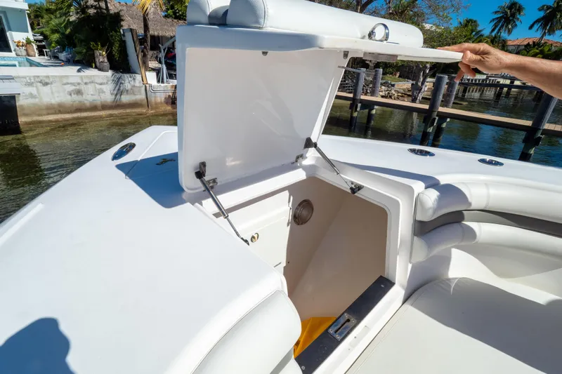 Slide: The Image of 2015 Intrepid 400 Center Console boat with spacious white seating area. - 89