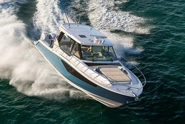 The Image of Manufacturer Provided Image: 2026 Boston Whaler 405 Conquest cruising swiftly on open water. - 0