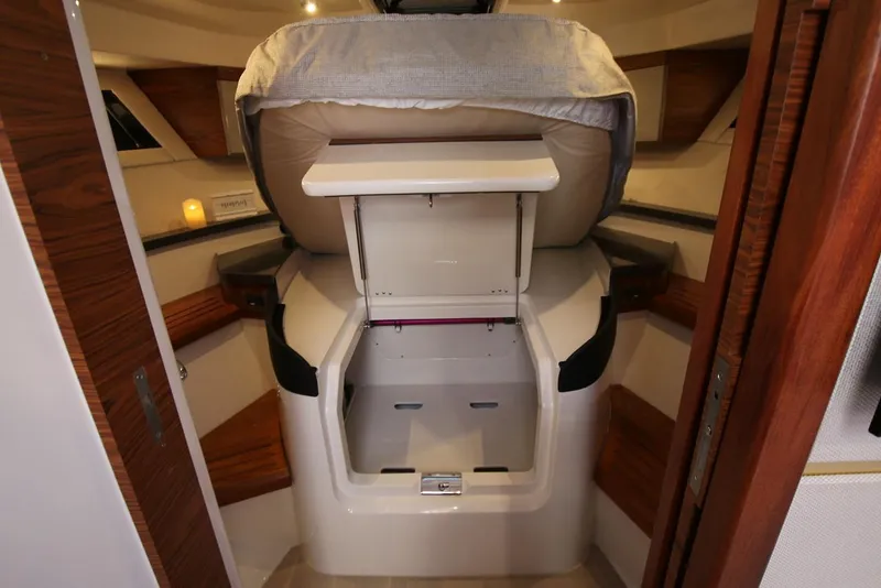 Slide: The Image of Manufacturer Provided Image: 2026 Boston Whaler 405 Conquest cabin interior with storage and seating. - 17