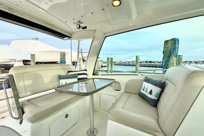 Slide: The Image of Luxurious interior of 2014 Boston Whaler 345 Conquest Pilothouse with waterfront view. - 14