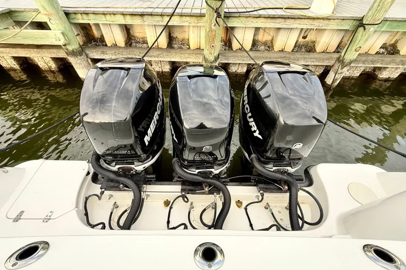 Slide: The Image of Triple Mercury outboard engines on a 2014 Boston Whaler 345 Conquest Pilothouse. - 26