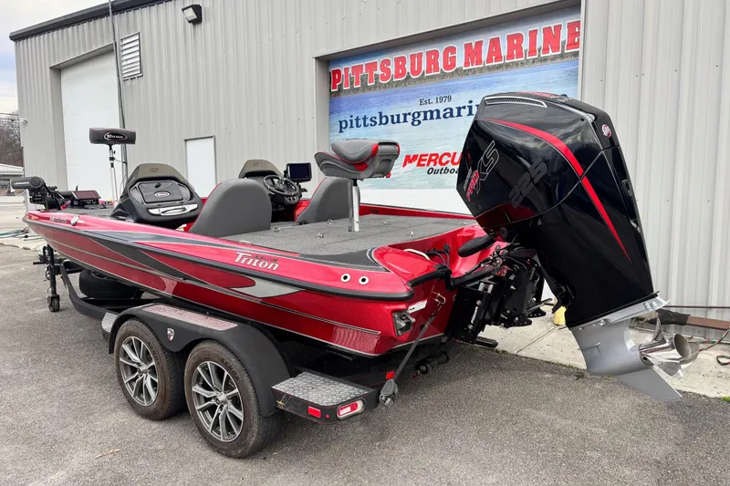 Slide: The Image of 2024 Triton 19 TrX Patriot boat with powerful engine at Pittsburg Marine. - 13