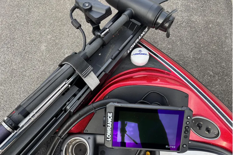 Slide: The Image of 2024 Triton 19 TrX Patriot boat with Lowrance electronics and trolling motor. - 2