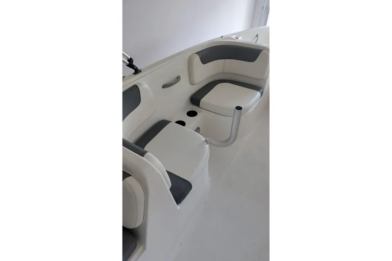 Slide: The Image of 2023 Bayliner Element E18 boat interior with white and gray seating. - 14