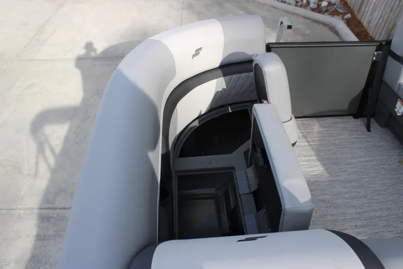 Slide: The Image of 2026 Starcraft EXS 3 Q boat interior with gray seating and storage compartments. - 13