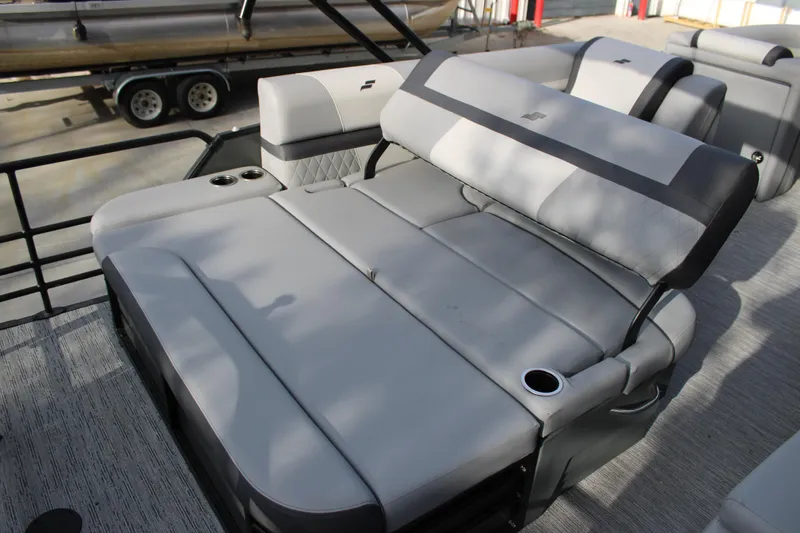 Slide: The Image of 2026 Starcraft EXS 3 Q boat interior with gray cushioned seating and cup holders. - 8