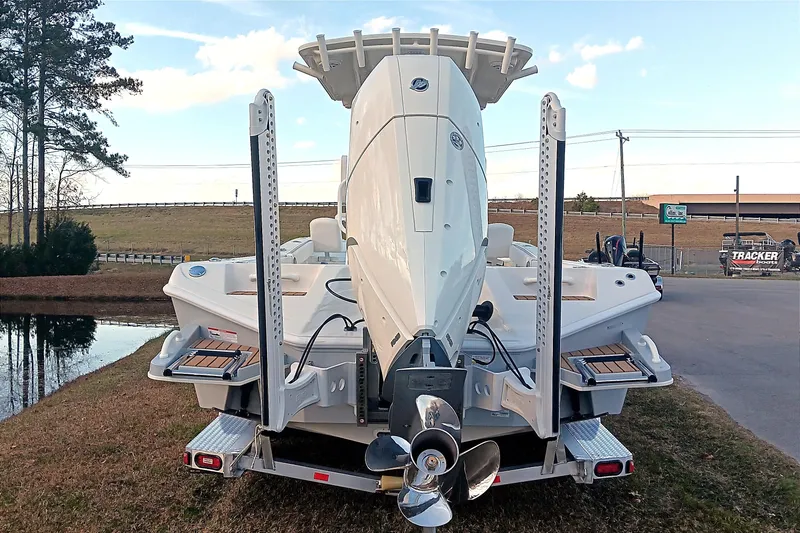 Slide: The Image of 2026 Ranger 2660 Bay boat on trailer, rear view with outboard motor. - 4