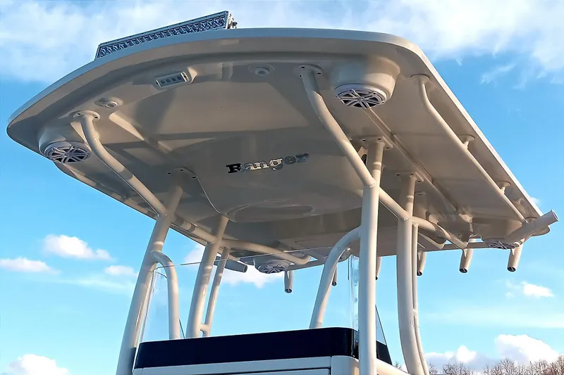 Slide: The Image of 2026 Ranger 2660 Bay boat canopy against a blue sky. - 7