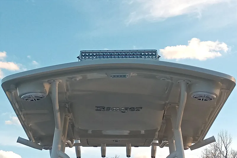 Slide: The Image of Ranger 2660 Bay 2026 boat roof with speakers and light bar against blue sky. - 8