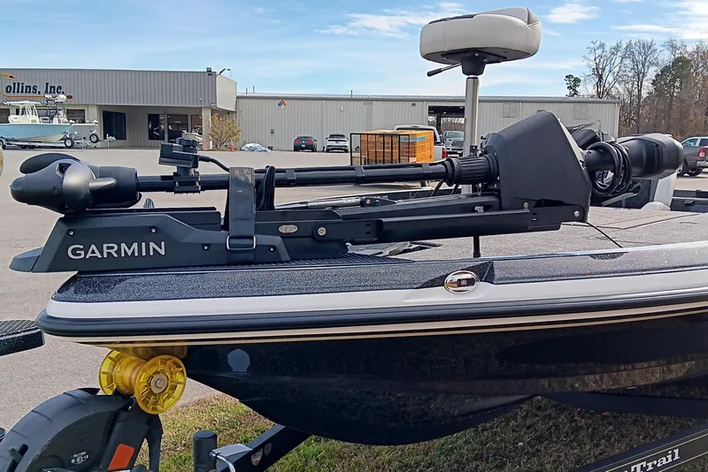 Slide: The Image of 2026 Ranger Z521R Cup-Equipped boat with Garmin trolling motor in a parking lot. - 13