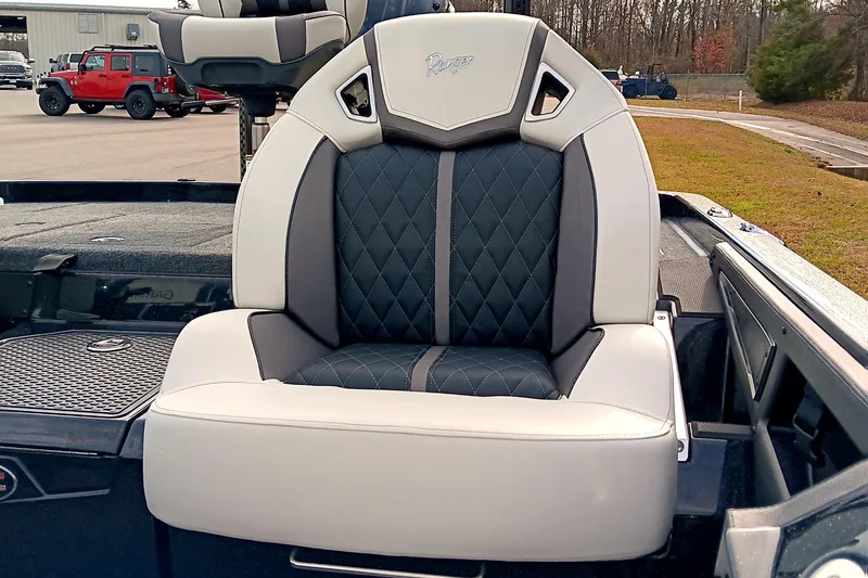 Slide: The Image of 2026 Ranger Z521R Cup-Equipped boat seat with diamond-stitched upholstery, parked outdoors. - 19