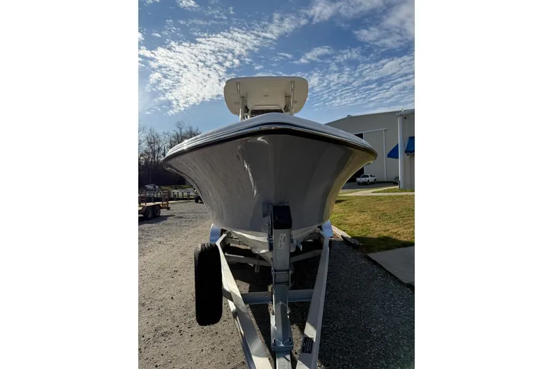Slide: The Image of 2026 Key West 239 FS boat on trailer under a clear blue sky. - 7