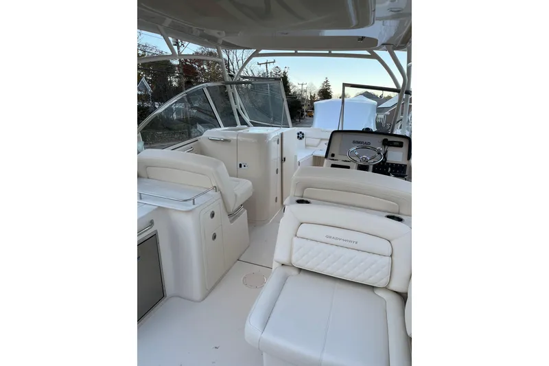 Slide: The Image of 2024 Grady-White Freedom 285 boat interior with helm and seating area. - 10