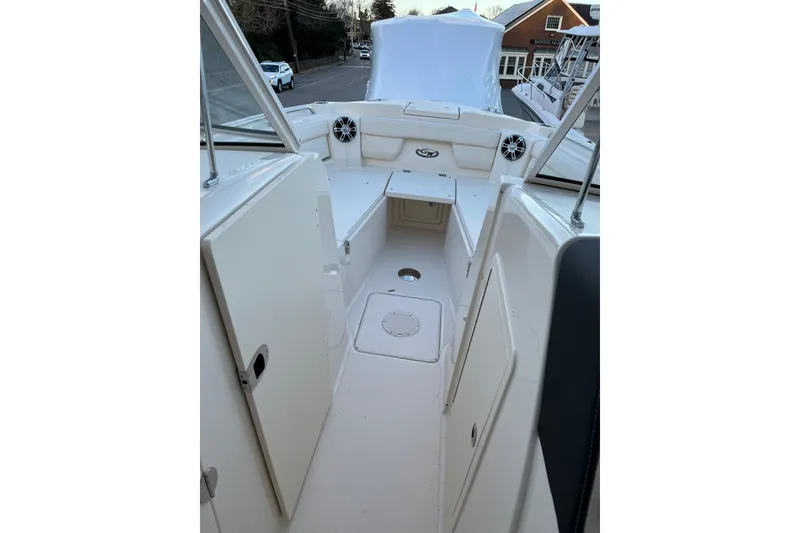 Slide: The Image of 2024 Grady-White Freedom 285 boat interior with seating and storage compartments. - 5