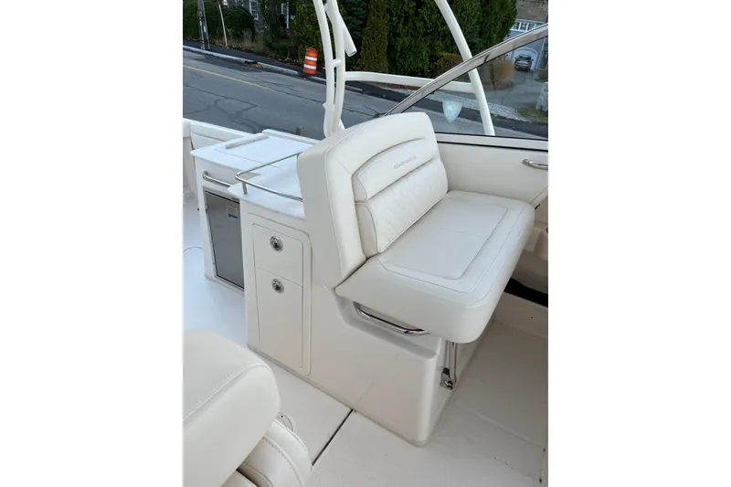 Slide: The Image of 2024 Grady-White Freedom 285 boat interior with luxurious seating and storage. - 6