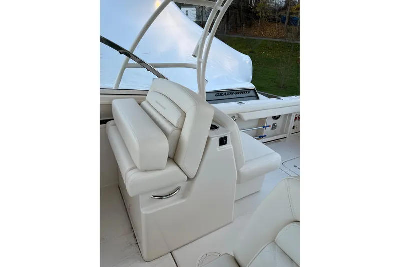 Slide: The Image of 2024 Grady-White Freedom 285 boat interior with white seating and sleek design. - 7