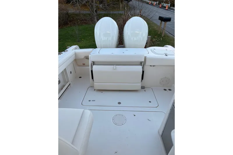 Slide: The Image of 2024 Grady-White Freedom 285 boat interior with dual outboard engines. - 9