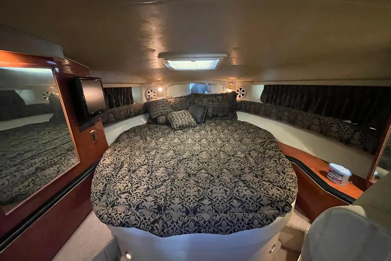 Slide: The Image of Luxurious 1999 Sea Ray 370 Sundancer yacht kitchen with wood cabinetry and modern appliances. - 13