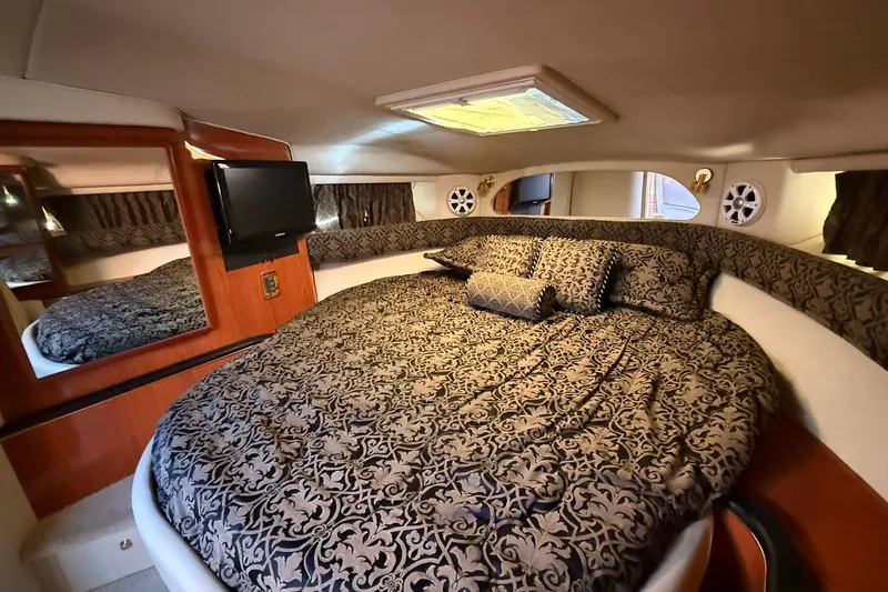 Slide: The Image of Luxurious interior of a 1999 Sea Ray 370 Sundancer yacht with modern amenities. - 14