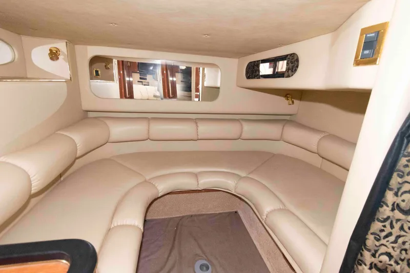 Slide: The Image of Luxurious interior of 1999 Sea Ray 370 Sundancer yacht with plush seating. - 18